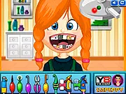 Naughty Girl at Dentist game screenshot showing a cartoon dentist using tools to clean or extract a tooth from a child patient