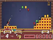 Free The Great Bazooki game screenshot on PlayArcadeHub, showing the magician throwing a card to pop a cluster of balloons.