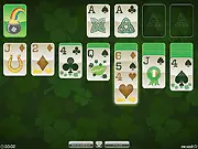 St. Patrick's Day Solitaire online game with green-themed cards, four-leaf clovers, and the classic Klondike tableau setup