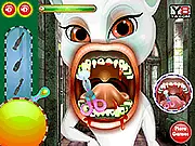 Talking Angela as a cartoon vampire getting her rotten teeth treated by a player in the free online dentist game, Angela Vampire Dentist