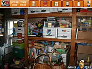 Hidden Objects Store Room game image showing a dark, cluttered room full of hidden objects for the player to find