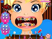 Polly Pocket at the Dentist game screenshot showing the cartoon character in the chair while the player uses tools to fix her teeth