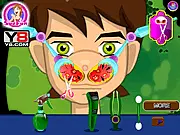 Ben 10 receiving treatment from a player using medical tools in the free online game, Ben 10 Nose Doctor