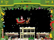 Playing Santa's Domain, a free online game where Santa drops a gift perfectly into a chimney on a snowy night.