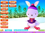 Screenshot of Winter Rabbit Dress Up free online game showing Winchester the rabbit wearing a warm hat, scarf, and sweater for his trip in the snow.