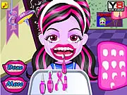 Play Baby Monster Teeth Problems free online doctor game, featuring a cute baby monster sitting in a dental chair with toothaches needing to be fixed.