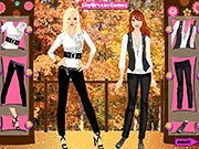 Screenshot of the Smart Fall Styles dress up game showing four animated girl characters side-by-side, all dressed in trendy autumn fashion like sweaters, boots, and scarves, ready for their outing.
