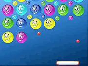 Screenshot of the Goop Pop Breakout free online game, showing a platform at the bottom bouncing a ball up to hit a cluster of colored bubbles.