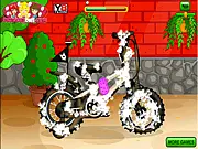 Kids Bike Wash free online cleaning game screenshot showing a boy washing a very dirty racing bike