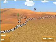 Desert Trial Bike game screenshot, motorbike performing a stunt over a sand dune, play free online trial game
