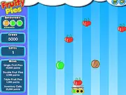 Screenshot of the Fruity Pies online arcade game showing a basket moving below a rain of colorful fruits like apples and berries, alongside dangerous gray rocks.