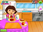 Dora sitting at a table filled with breakfast items including an egg, milk, and an apple, ready to eat in the Dora's Morning Routine game