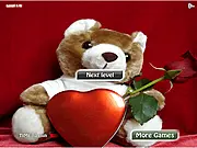 Valentine Match Game screen showing a grid of face-down cards and a few flipped-over cards revealing sweet romantic images like hearts and flowers