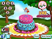 Winx Cake Decor free online girl game screenshot showing a decorated fantasy cake
