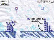 A screenshot of the Save The Dummy Holidays game showing a ragdoll dummy tied up in a structure made of festive blocks, with some red objects highlighted for clicking to solve the physics puzzle.