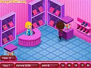 Screenshot of Carly's Fancy Jewellery game showing diamonds and gems being set into a design, free online design game