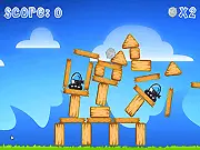 Catapult Kit online game screenshot showing a launched projectile hitting a stack of wooden blocks and boxes