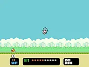 Flappy Hunt game screenshot showing an 8-bit shooting screen with pixelated Flappy Birds flying over a field free online