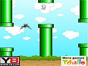 The tiny bat character from the Flappy Bat y8 game flapping its wings between two green pipes in an attempt to set a new high score