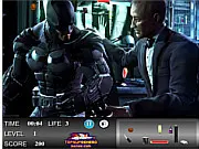 Batman Hidden Objects game image featuring the Batman logo and various hidden items like a Batarang and Joker card overlaid on a dark Gotham City scene