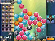 Popping Ghosts online game screenshot showing a grid of colorful, spherical monster balls being cleared by a player's click in a fun puzzle game setting