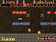 Super Julio 5, a red-capped hero, jumping over a small enemy monster while collecting a ruby in a subterranean level.