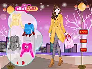 New Wardrobe for Winter online dress-up game screenshot showing a doll wearing an elegant, layered winter coat and fashionable boots.