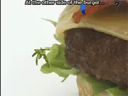 A colourful screenshot from The Great Burger Escape, showing a character navigating a path through various layers and ingredients of a giant hamburger puzzle.