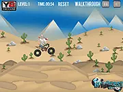 Rat On A Dirt Bike free online game screenshot showing a rat character riding a dirt bike over a desert dune