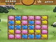 Cave Fruits Match 3 online free puzzle game screenshot showing colorful prehistoric fruits lined up on the game board on PlayArcadeHub