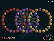 Screenshot of Space Rings free online puzzle game showing concentric rings with mixed colored balls needing alignment