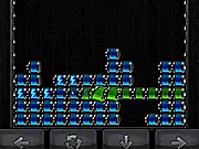 Screenshot of Block REvolt puzzle game showing colorful battery blocks on a grid, attempting to guide them into position to complete an electrical circuit.