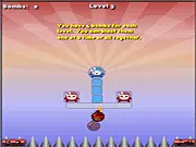 Gameplay screenshot of BobbleBombs Online, showing a small bomb next to red and blue bobble-headed characters on a multi-tiered platform, illustrating the physics puzzle mechanic.