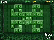Find the Lucky Spot free online game screenshot showing a grid of tiles with a few small sparkles indicating where the four leaf clover is hidden