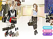 Military Elements Dress Up game image showing a model wearing camouflage clothing, a military green vest, and a handsome cap
