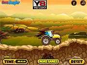 A small red tractor driving on a bumpy off-road track while pulling a trailer full of farm animals