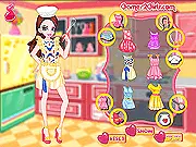 A girl wearing a stylish white chef's hat, a pink polka dot apron, and a cooking uniform from the In the Kitchen dress-up game
