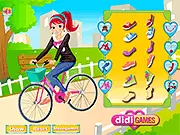 Screenshot of Cute Travel Girl Dressup game, showing a female character dressed in stylish casual clothes suitable for a weekend bike ride through a park.