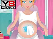 Ambulance Doctor Flash online game featuring a doctor monitoring a pregnant patient in a hospital emergency room.