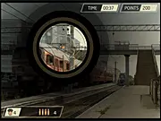Screenshot of Trainyard Shootout Sniper game, showing the scope of a sniper rifle aimed at a terrorist figure in a gritty trainyard environment.