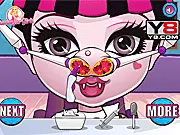 Baby Monster Nose Doctor free online game screenshot showing a cute monster patient with a doctor using medical tools to examine its nose