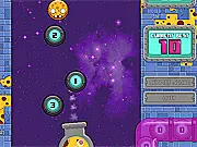 Cosmic Cannon game screenshot showing a cannon at the bottom of the screen firing a small ball at a larger, numbered metallic ball suspended in a starry, blue cosmic environment - Free Online Game