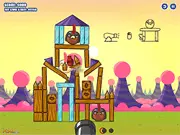 The Sweet Menace game screen showing a cannon aiming to shoot a projectile at colorful candies set on block structures