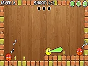 Playing Paint Wars free online puzzle game, launching a yellow ball to hit a star, squishing an orange ball, physics puzzle strategy.