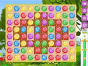 Gameplay screenshot of the Sweet Candies match 3 online game showing multiple rows of colorful candies and chocolate tiles on the board.