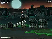 Zombie rider performing a stunt on a dirt bike in the apocalyptic Atomic Zombie Motocross game