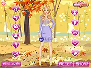 Autumn Trend Girl free online game featuring a stylish girl dressed in the latest fall fashion trends, including a cozy sweater and boots, against an autumn background