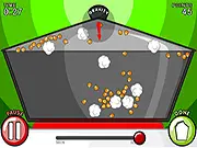 Gameplay screenshot from I Make Popcorn, showing popcorn kernels being popped in a pan by adjusting heat and gravity in the free online physics game.