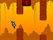 The Flabby Bat character flying between a narrow gap of stalagmites and stalactites in the cave in the online arcade game Flabby Bat