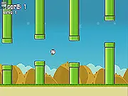 The Flappy Cow character, a large brown cow with tiny wings, trying to fly between two green pipes in the online arcade game Flappy Cow